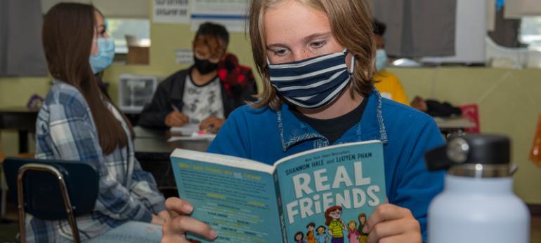 student reading a book