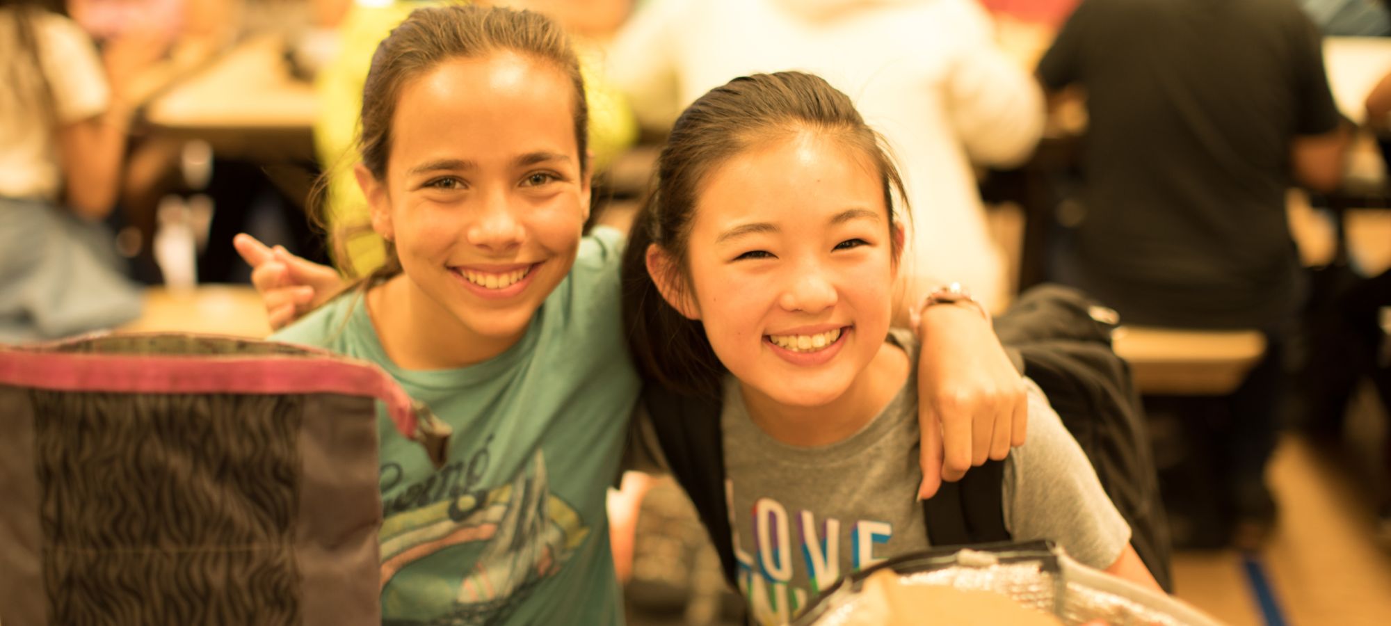 students pose while eating lunch