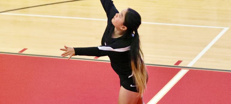 Chloe playing volleyball